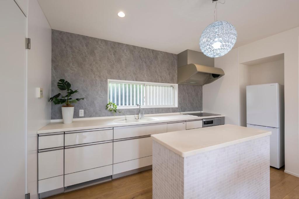 Kuchyň nebo kuchyňský kout v ubytování private villa 九十九里
