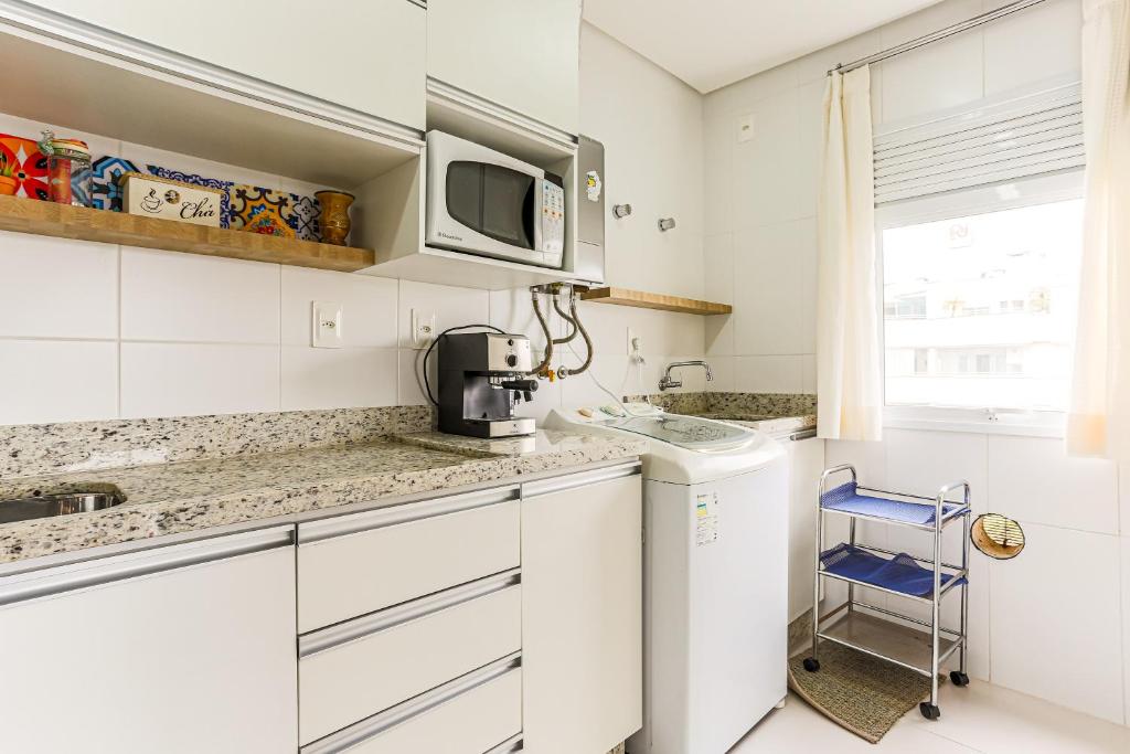  Apartamento lindo e aconchegante em Jurerê SGA202