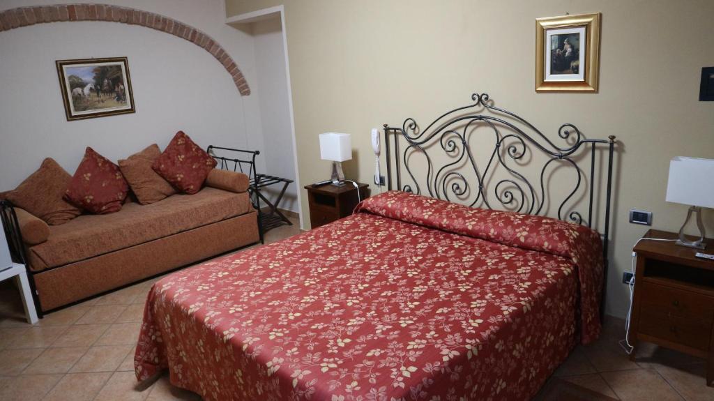 Postel nebo postele na pokoji v ubytování La Regibussa - Hotel Ristorante