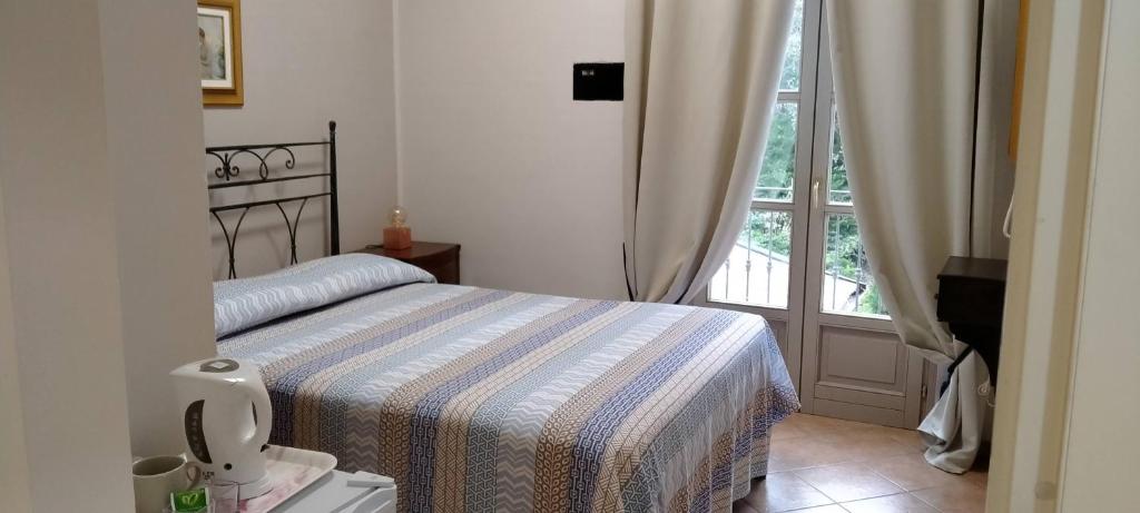 Postel nebo postele na pokoji v ubytování La Regibussa - Hotel Ristorante