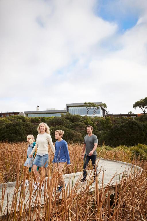 a group of people standing on a walkway at RACV Inverloch Resort in Inverloch