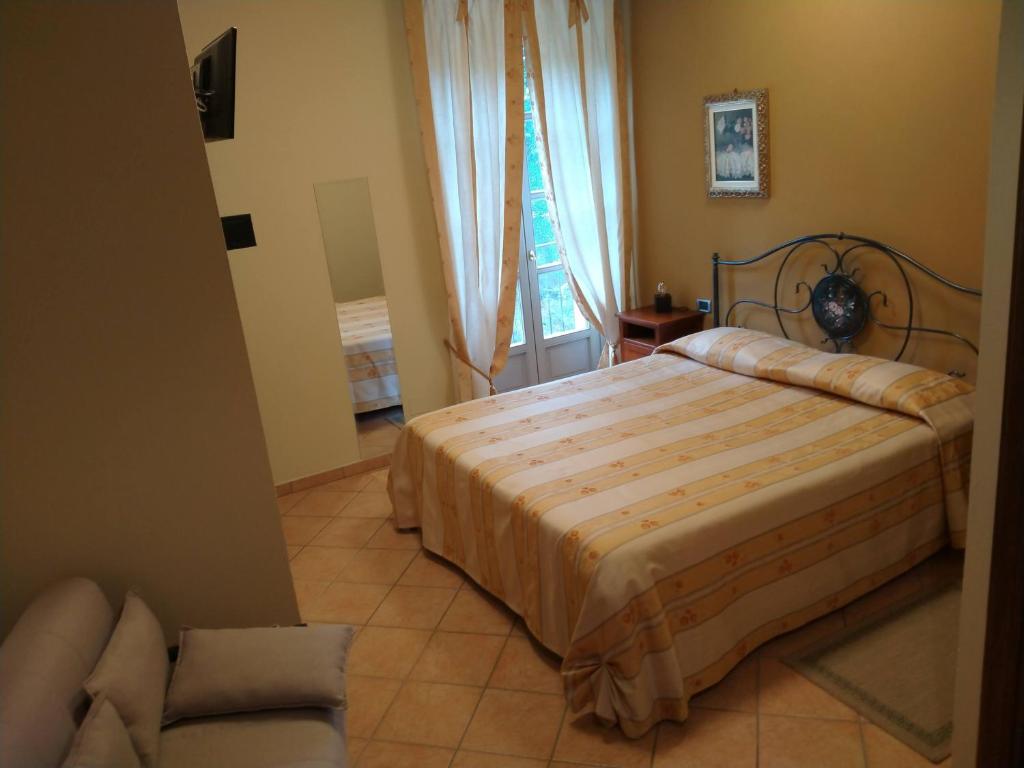Postel nebo postele na pokoji v ubytování La Regibussa - Hotel Ristorante