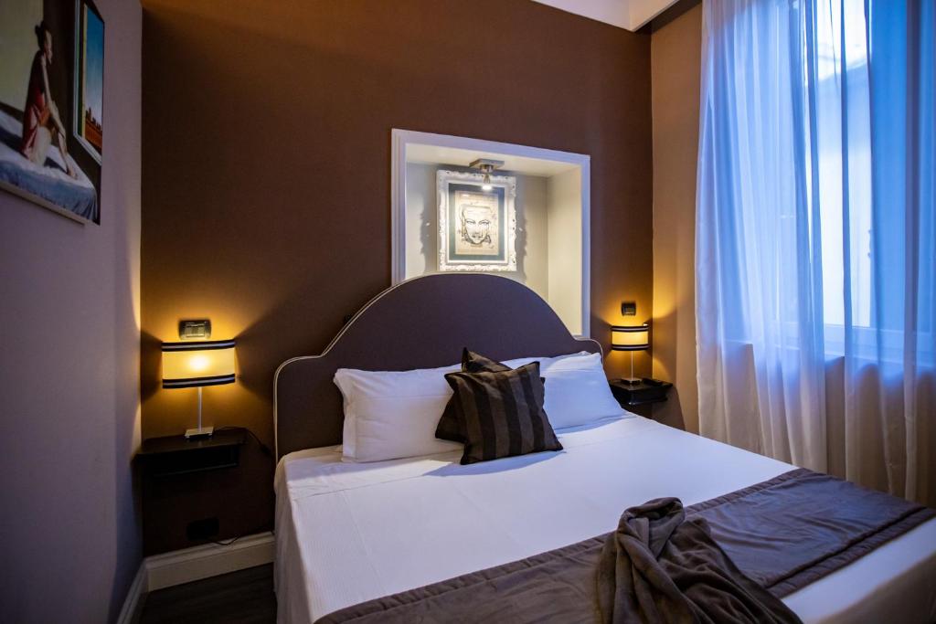Posteľ alebo postele v izbe v ubytovaní JB Relais- Campo de' Fiori
