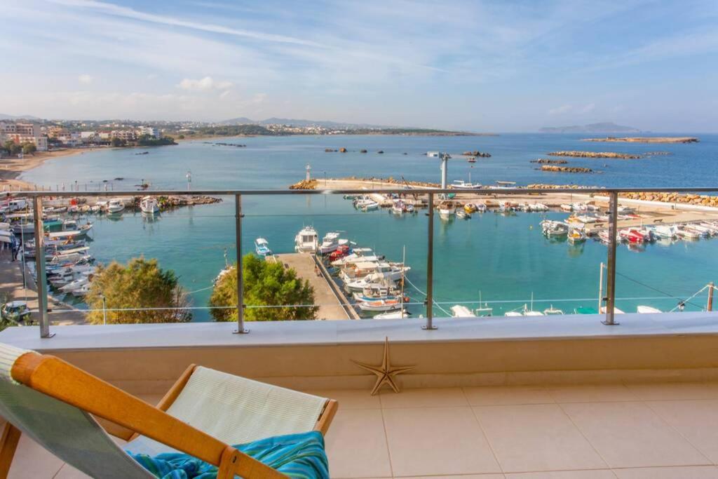a balcony with a view of a marina at Sea & Town Getaway in Chania