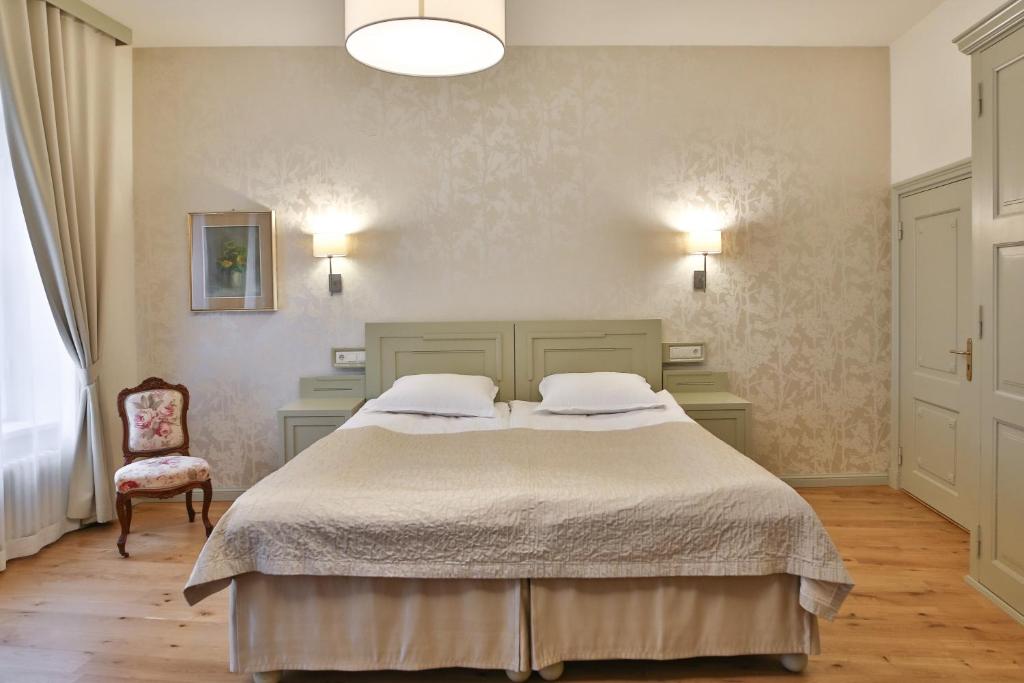 Voodi või voodid majutusasutuse Antonius Hotel toas