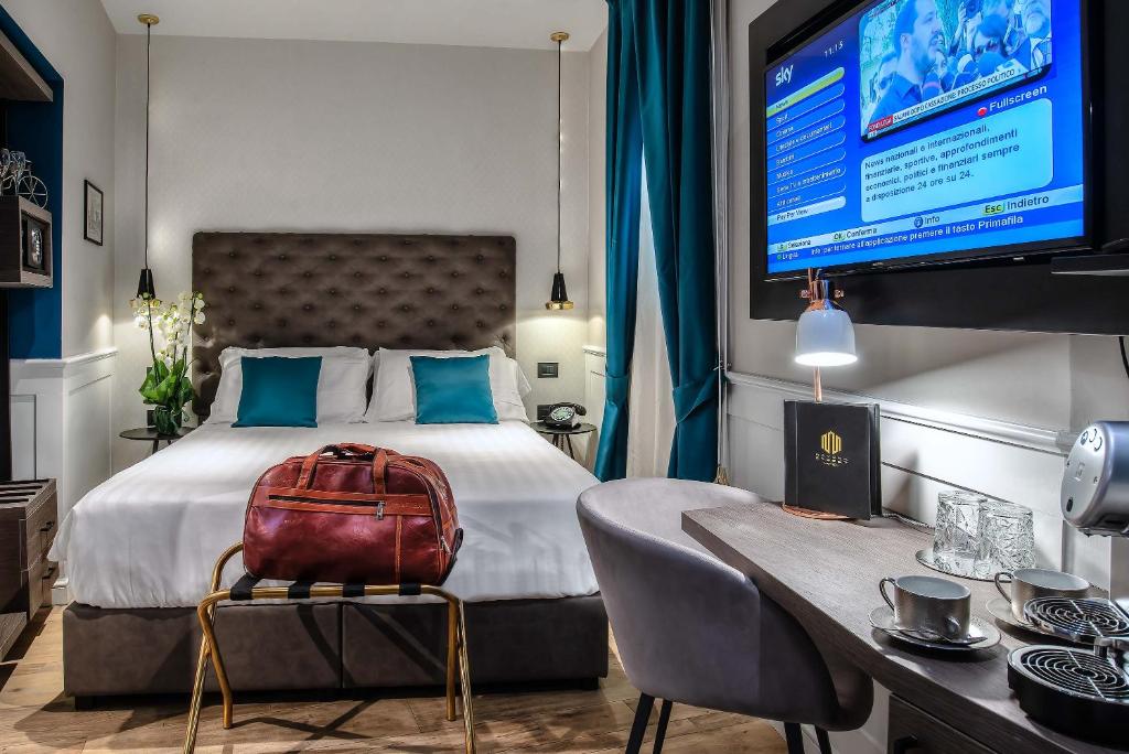 A bed or beds in a room at Navona Street Hotel