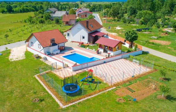 an aerial view of a house with a swimming pool at Vila NINA in Gospić