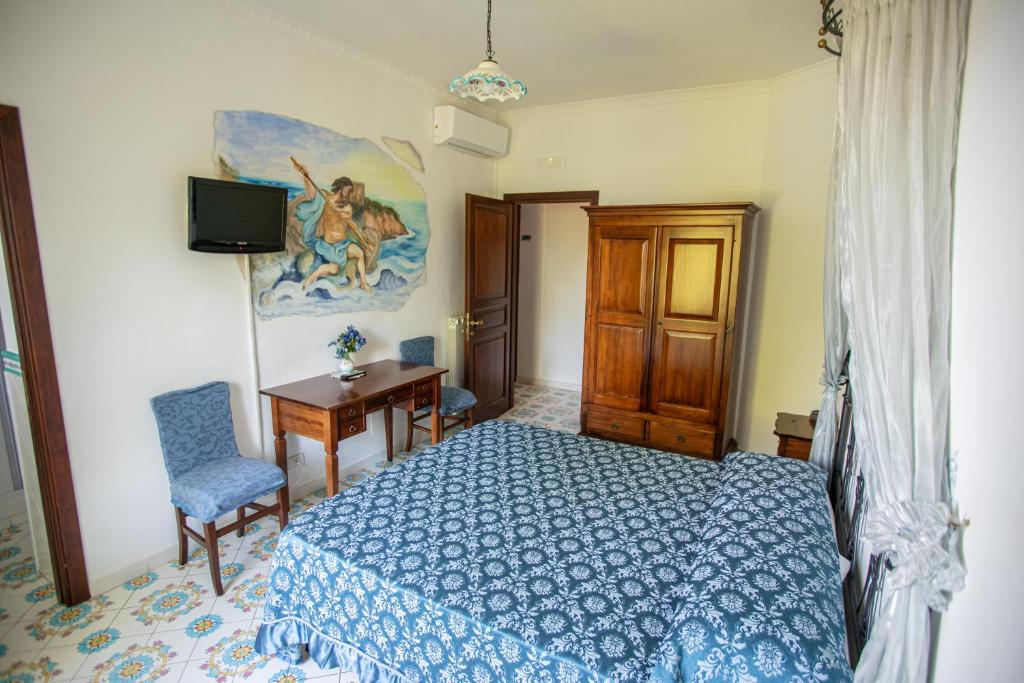 Postel nebo postele na pokoji v ubytování Nido Degli Dei