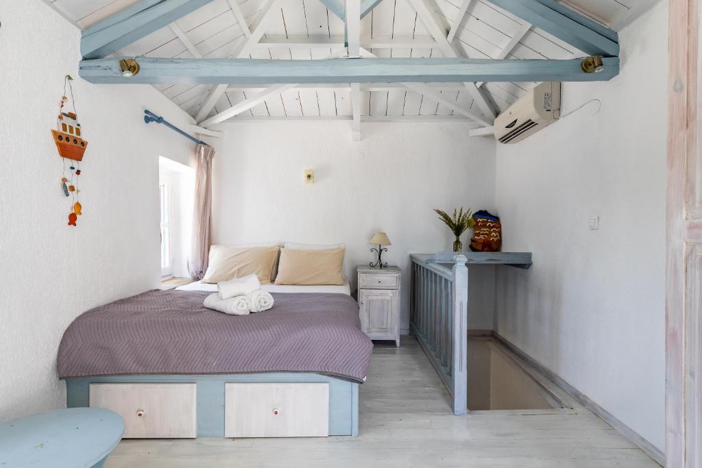 Postel nebo postele na pokoji v ubytování Pigi Cottage