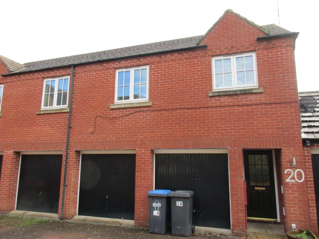 a red brick building with two parking spaces at 20 Nightingale Gardens, Coton Park, Rugby CV23 0WT in Rugby
