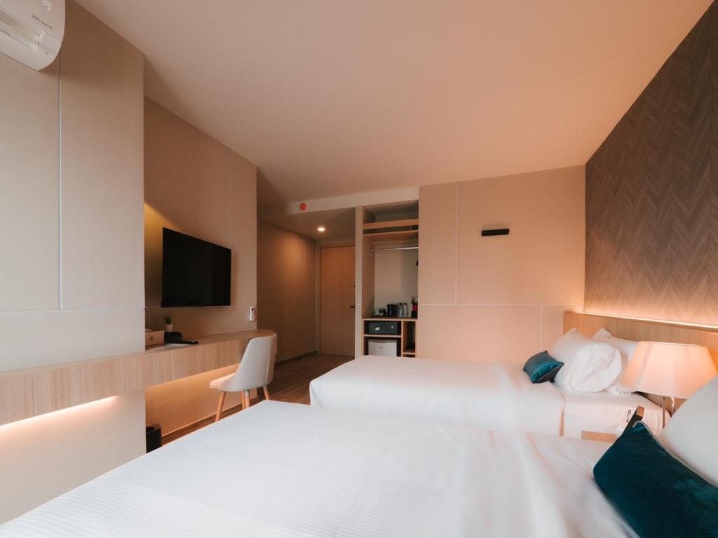 Postel nebo postele na pokoji v ubytování 56 Hotel