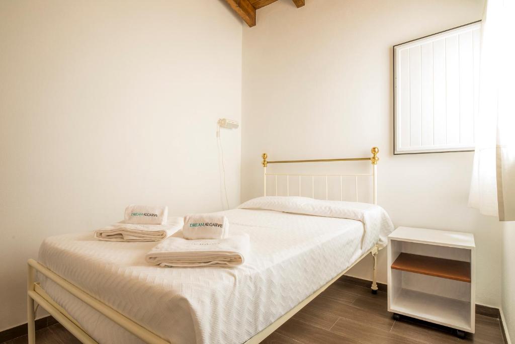 Postel nebo postele na pokoji v ubytování C14 - Casa da Luz