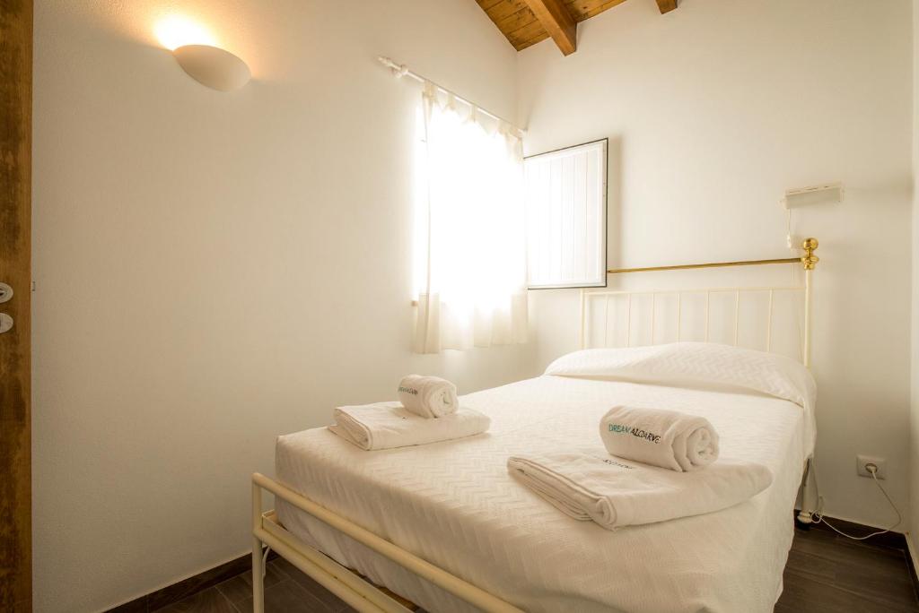 Postel nebo postele na pokoji v ubytování C14 - Casa da Luz