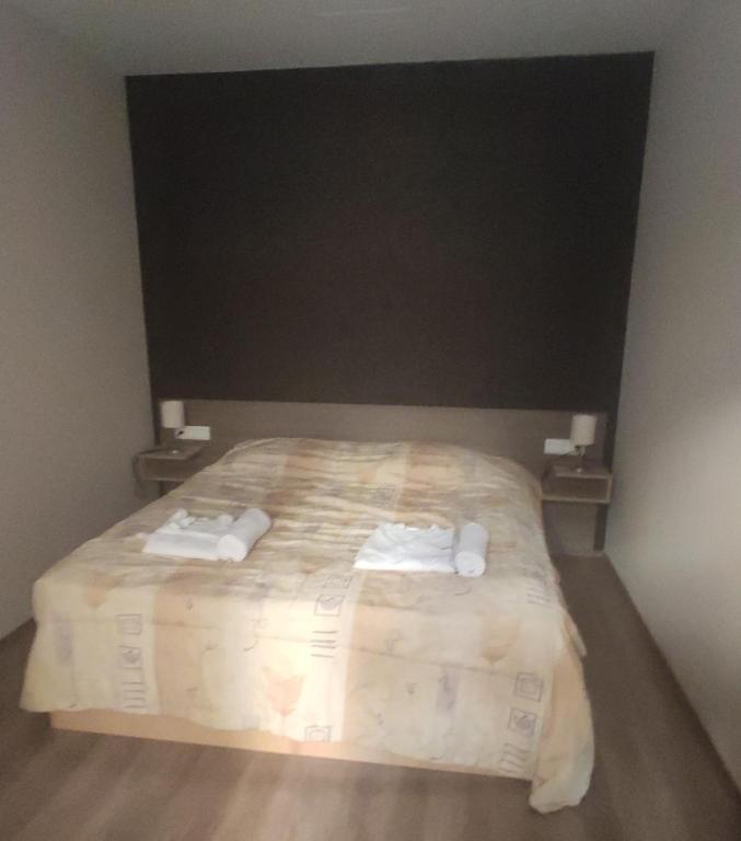 Posteľ alebo postele v izbe v ubytovaní Solaris Apartman
