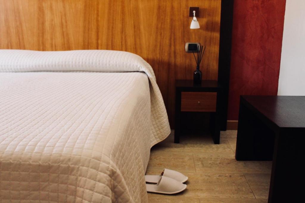Postel nebo postele na pokoji v ubytování Hotel Naitendì