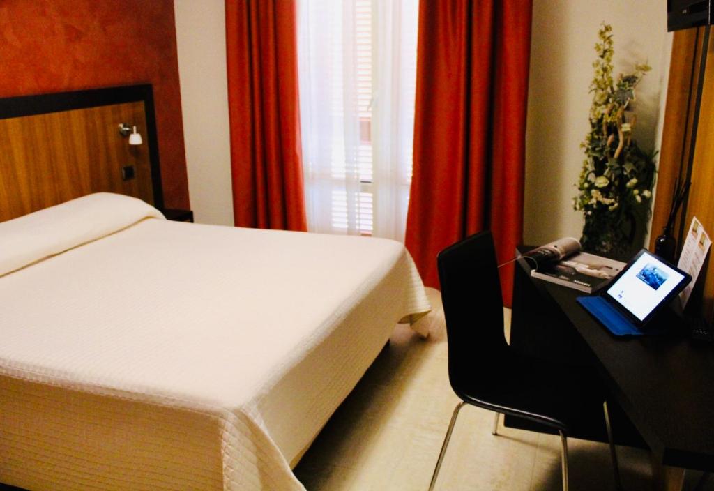 Postel nebo postele na pokoji v ubytování Hotel Naitendì
