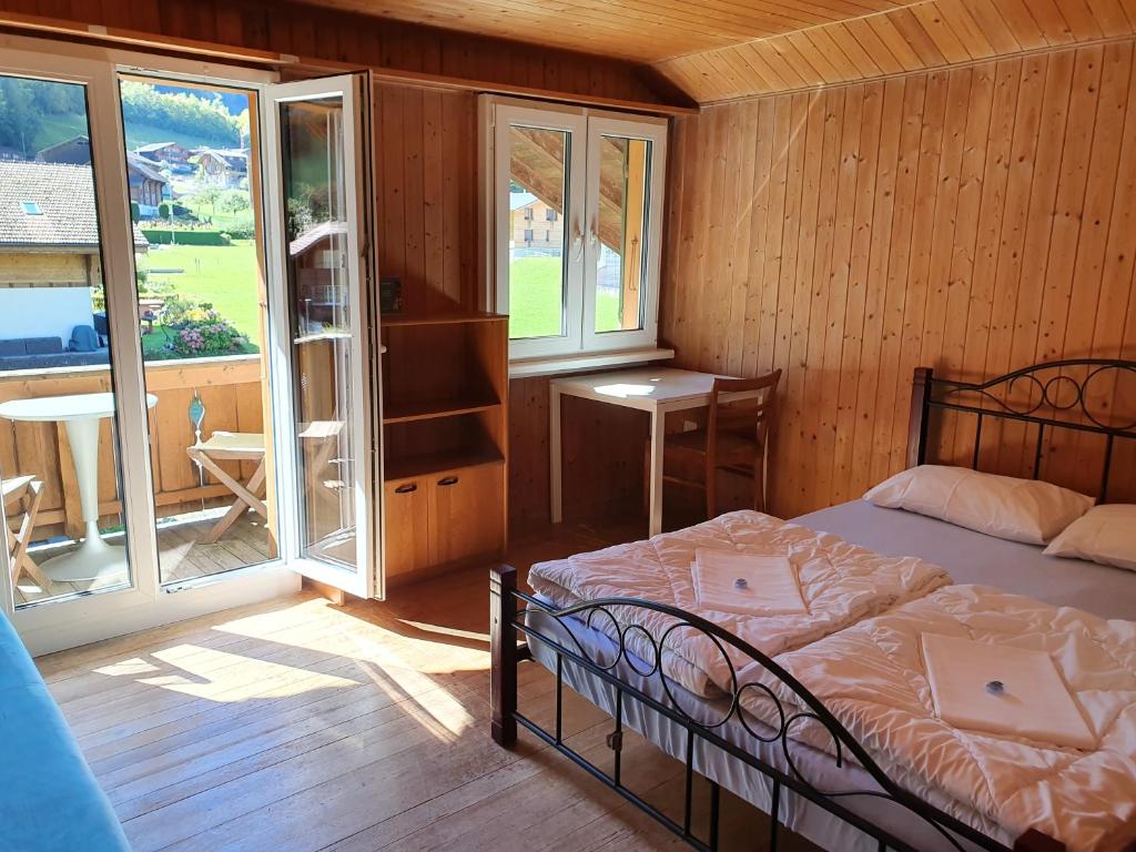 Postel nebo postele na pokoji v ubytování Lake Lodge Hostel