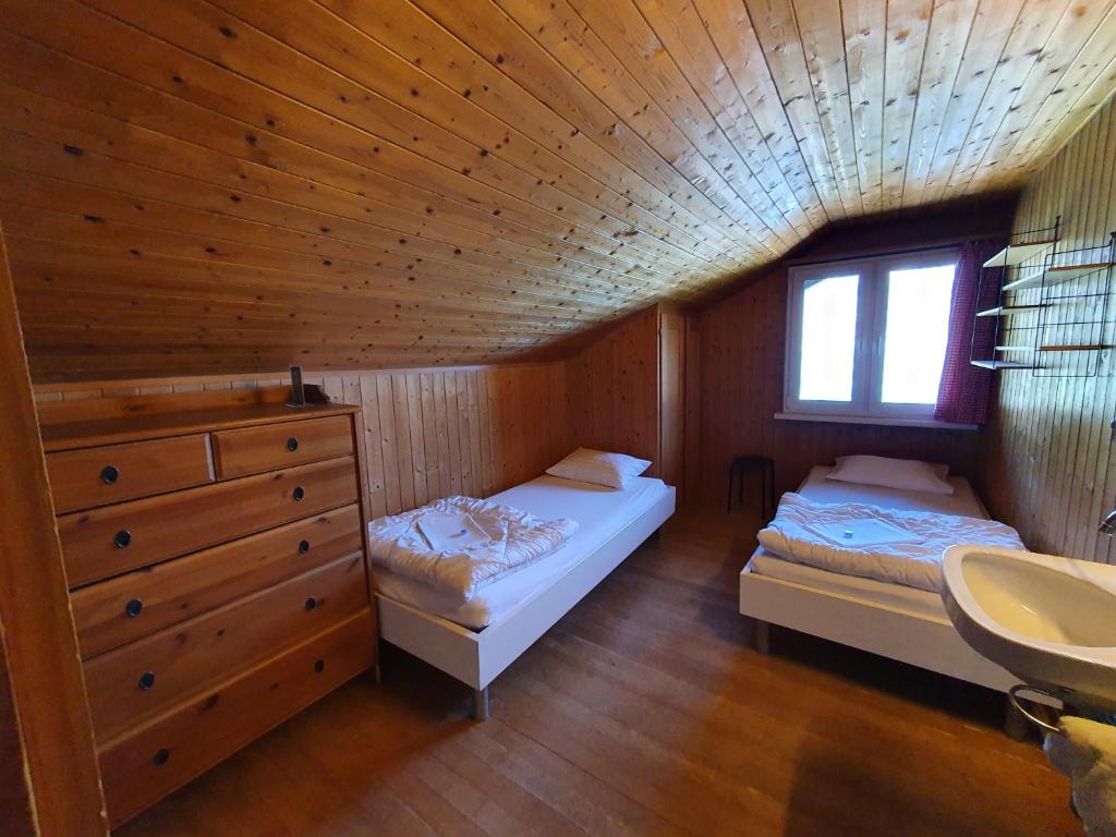 Postel nebo postele na pokoji v ubytování Lake Lodge Hostel