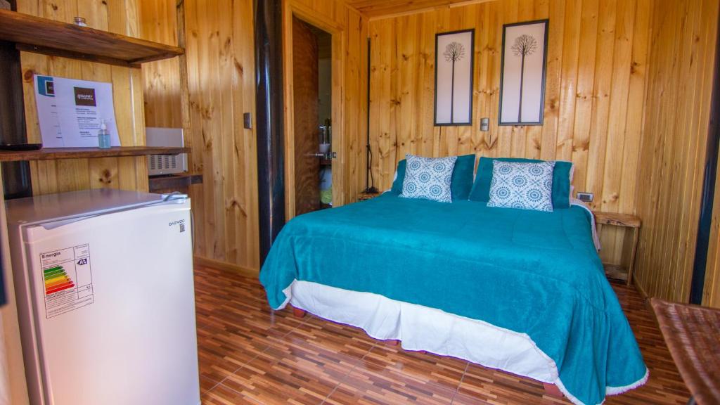 Uma cama ou camas num quarto em ELUNEY Pichilemu