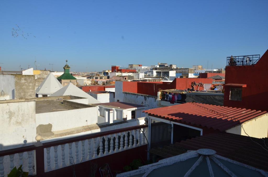 a view of a city with roofs and buildings at chambre priver in Rabat