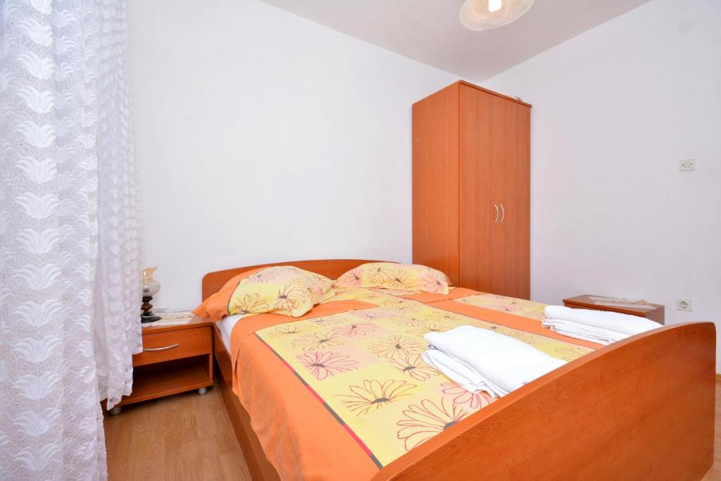 Postel nebo postele na pokoji v ubytování Apartments Bjanka