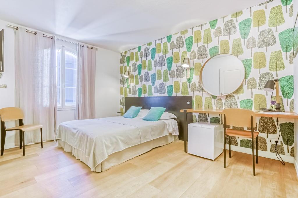 Postel nebo postele na pokoji v ubytování Hôtel & Appart-hôtel Olatua