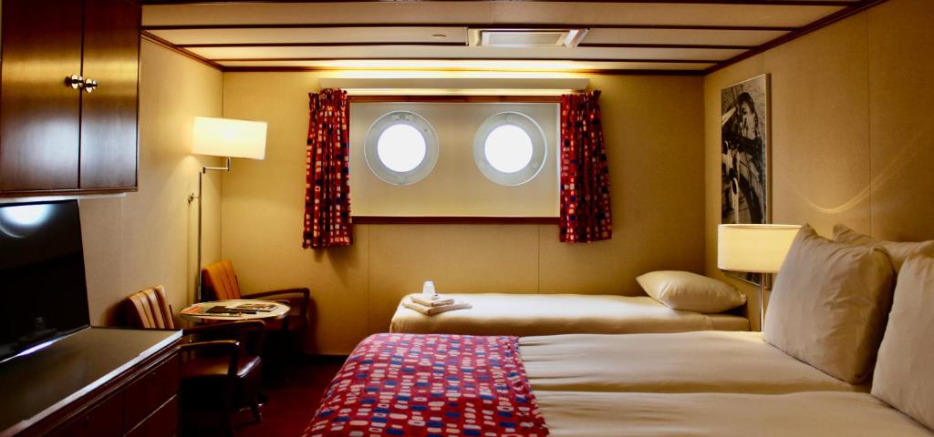 Letto o letti in una camera di ss Rotterdam by WestCord
