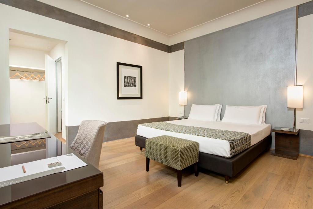 Postel nebo postele na pokoji v ubytování Hotel Orto de' Medici