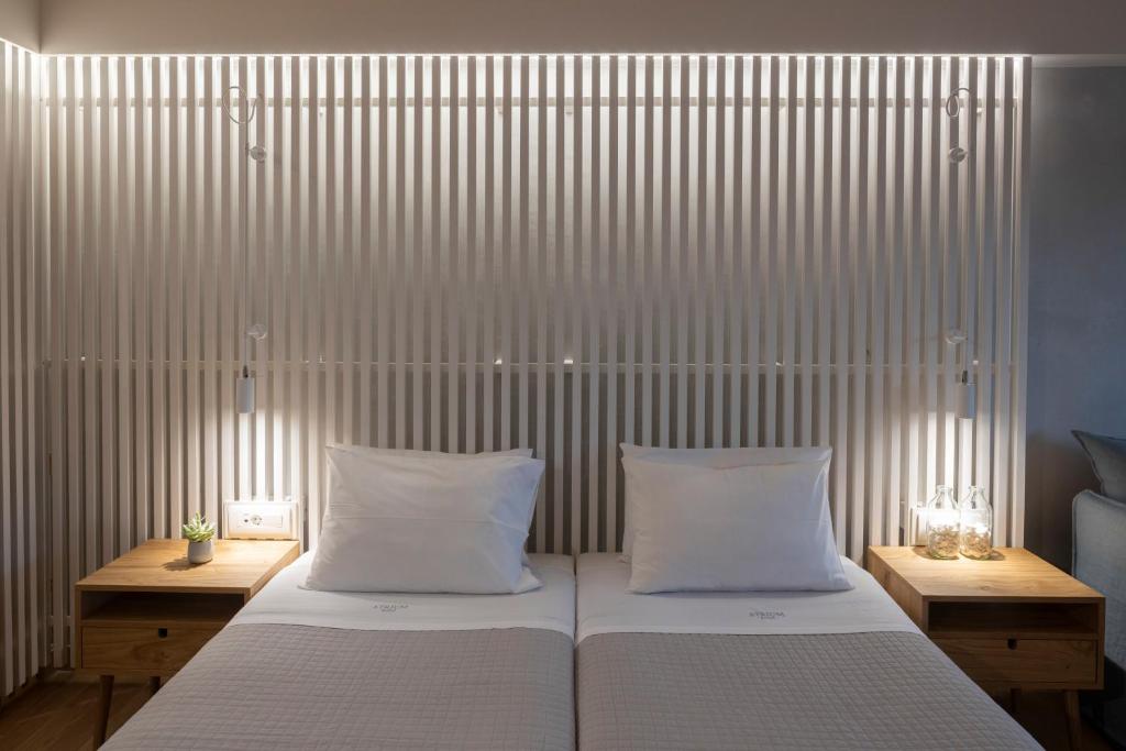 Postel nebo postele na pokoji v ubytování Atrium Hotel
