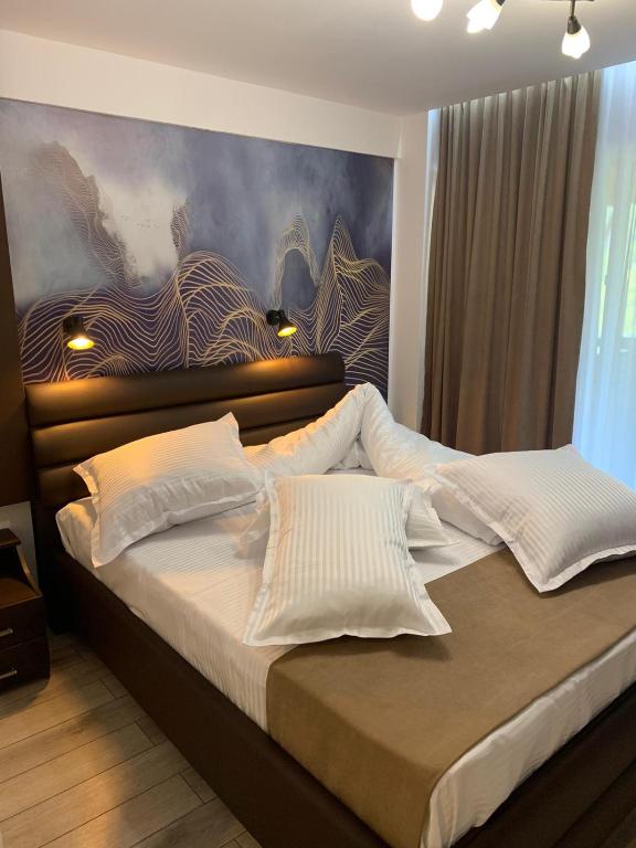 Postel nebo postele na pokoji v ubytování Doftana Apartaments