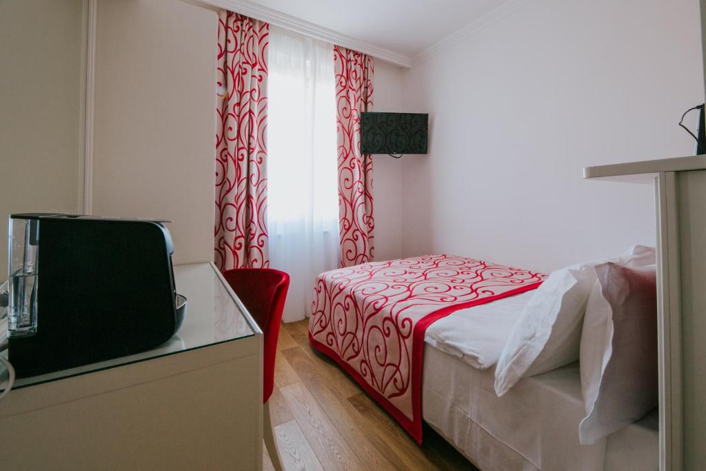 TV a/nebo společenská místnost v ubytování Hotel Città di Parenzo