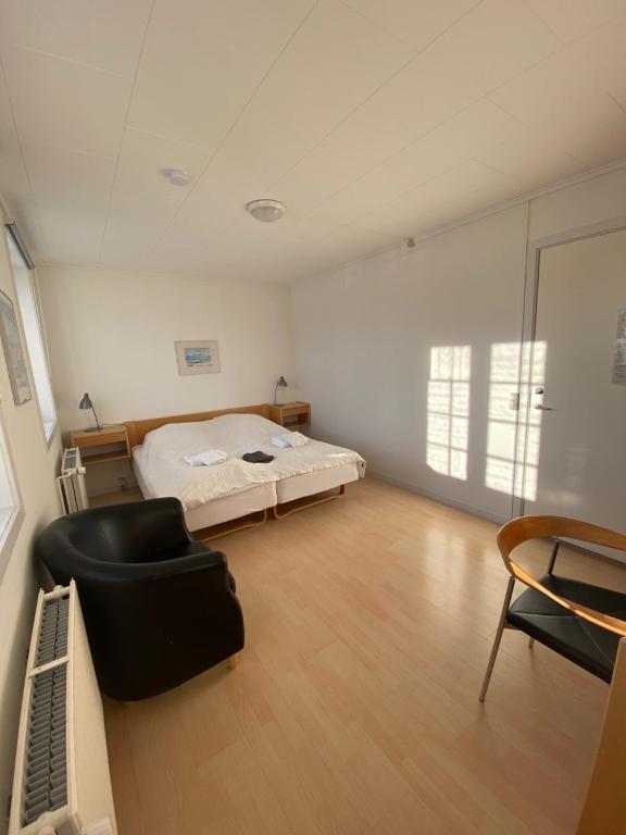 Postel nebo postele na pokoji v ubytování Hotel Disko Island