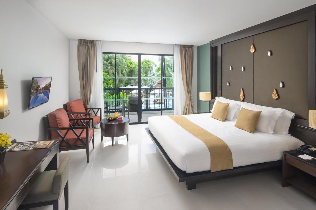 Postel nebo postele na pokoji v ubytování Centara Anda Dhevi Resort & Spa Krabi