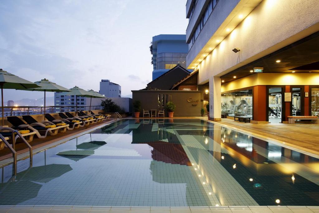 a swimming pool on the roof of a building at Centara Hotel Hat Yai in Hat Yai