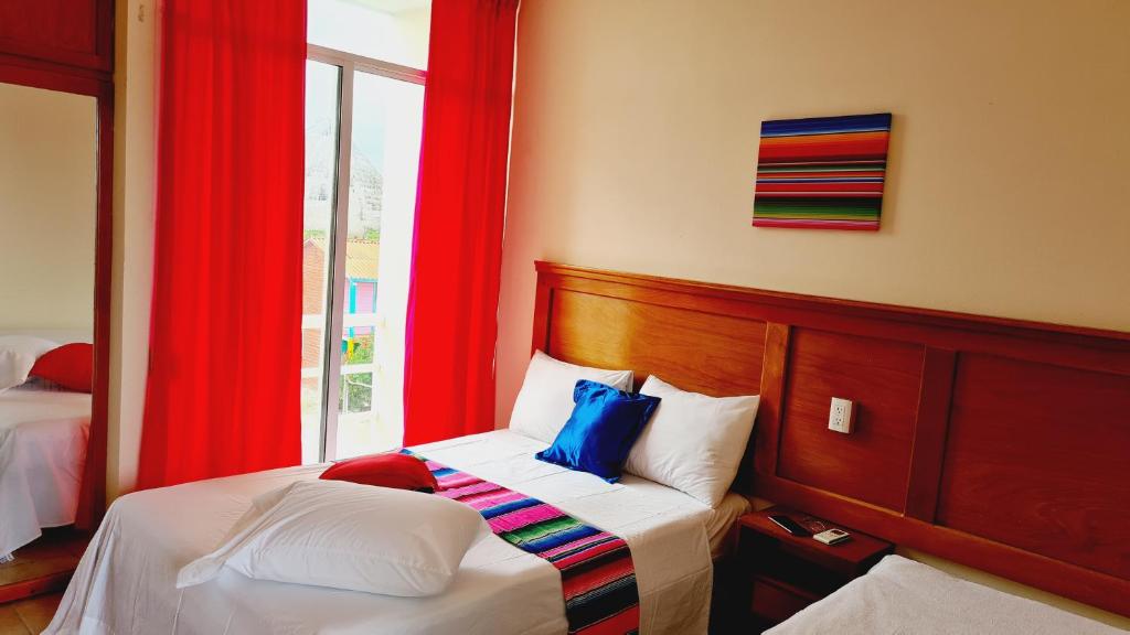 Postel nebo postele na pokoji v ubytování Hotel Machos Mahahual