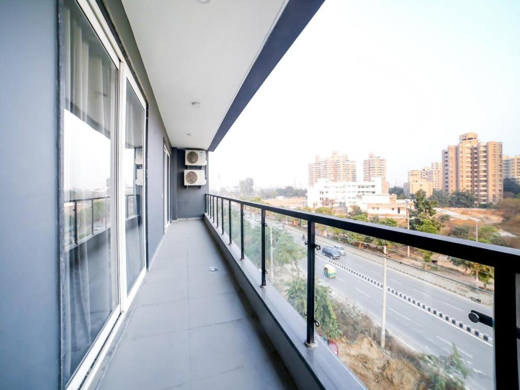 a balcony in a building with a view of a street at Flora Residency in Gurgaon