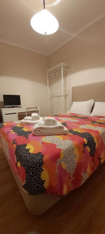 A bed or beds in a room at Maia (Oporto) Suites