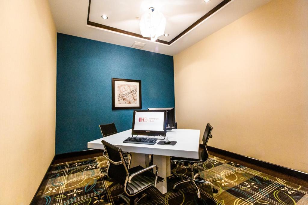 a room with a desk with a laptop on it at Holiday Inn Express & Suites Spruce Grove - Stony Plain by IHG in Spruce Grove