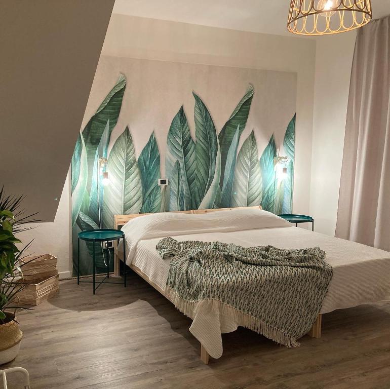 A bed or beds in a room at Sunrise