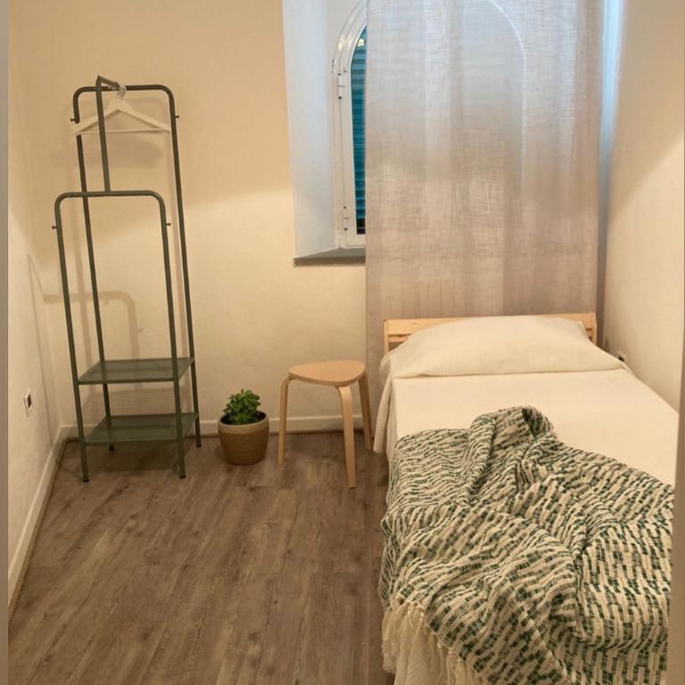 A bed or beds in a room at Sunrise