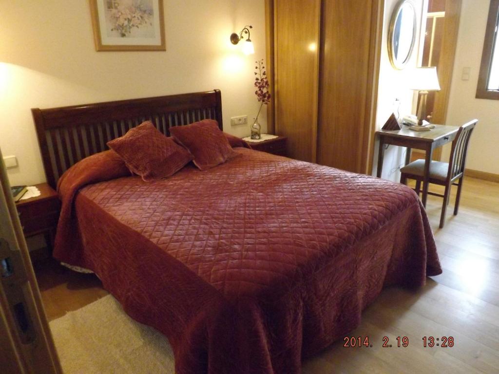 Postel nebo postele na pokoji v ubytování Hotel Azkue
