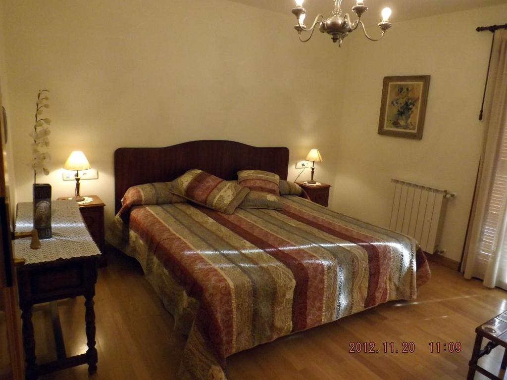 Postel nebo postele na pokoji v ubytování Hotel Azkue