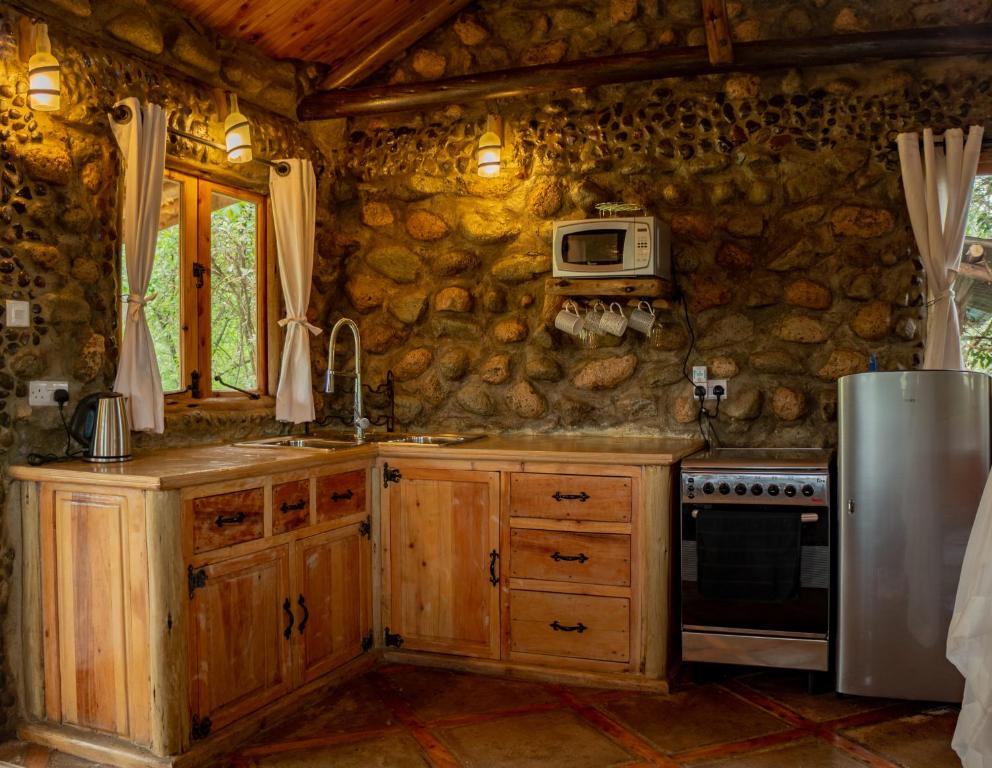 Kuchyň nebo kuchyňský kout v ubytování Honeymoon Hut