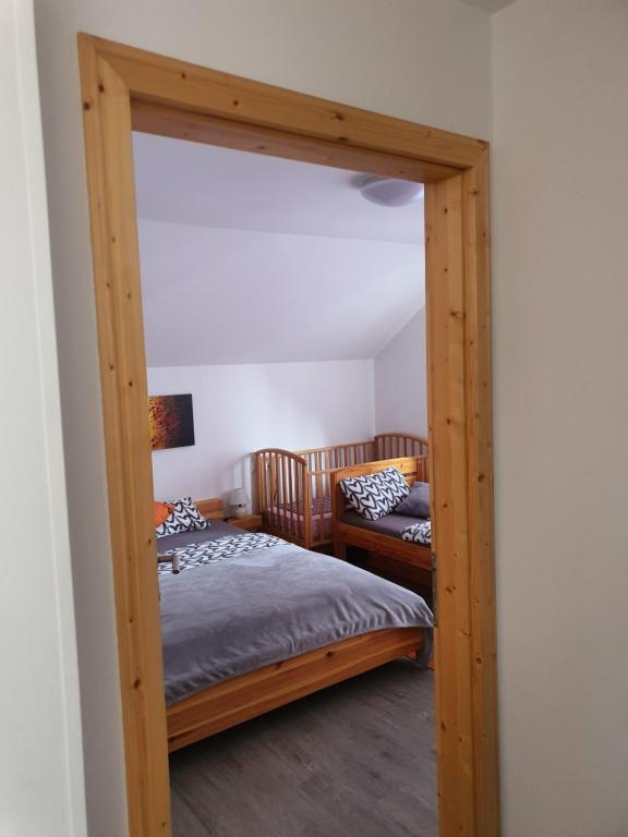 Postel nebo postele na pokoji v ubytování Apartmaji Daniel