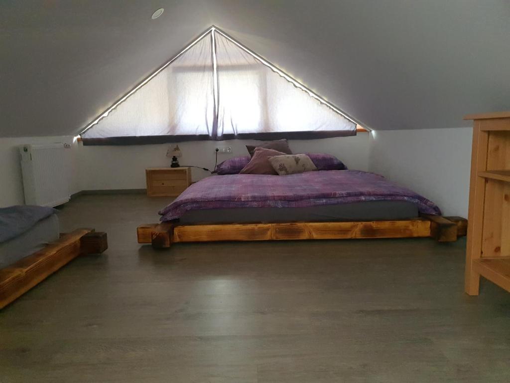Postel nebo postele na pokoji v ubytování Apartmaji Daniel