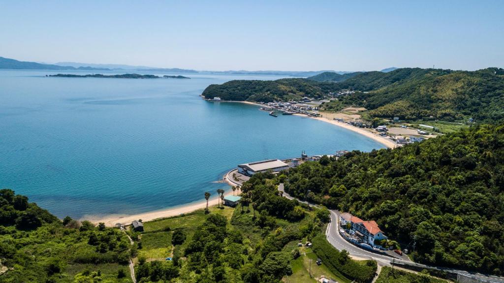 an aerial view of a beach and a body of water at Pension KUROSHIOMARU in Setouchi