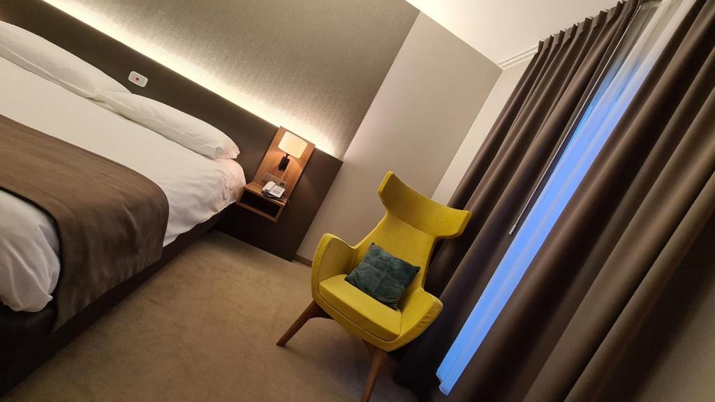 Postel nebo postele na pokoji v ubytování Hotel Drie Eiken