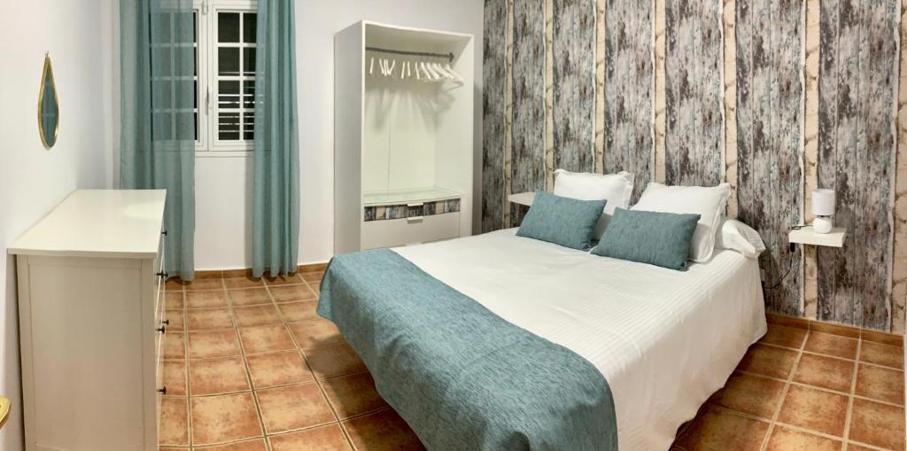 A bed or beds in a room at Pico Partido villa heated pool