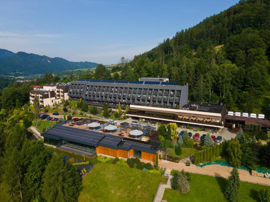 an aerial view of a building with a train station at Sanatorium Budowlani Szczawnica in Szczawnica