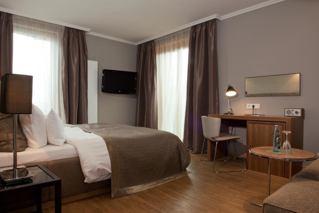 Postel nebo postele na pokoji v ubytování Hotel Gude